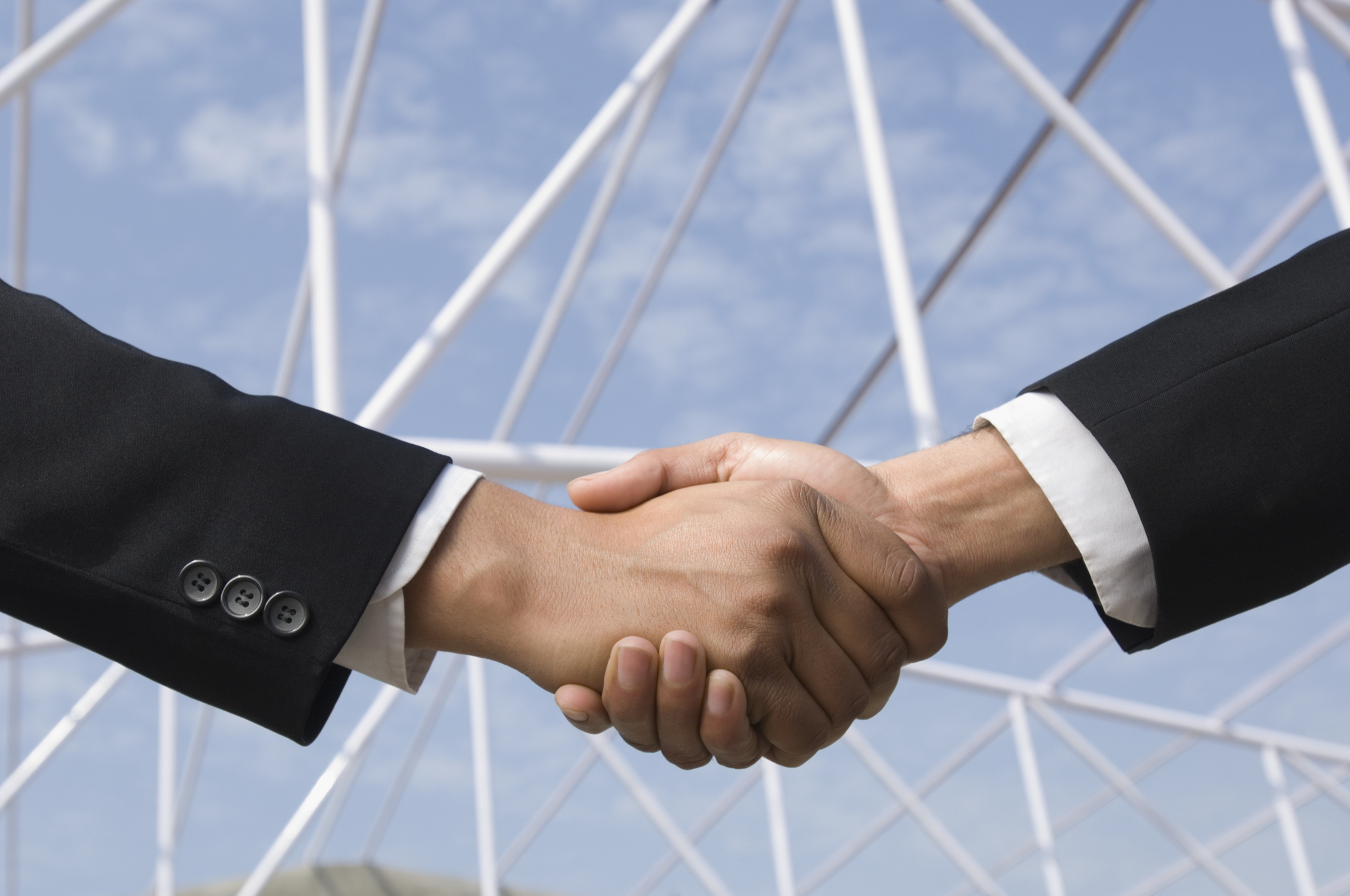 Close-up of two businessmen shaking hands